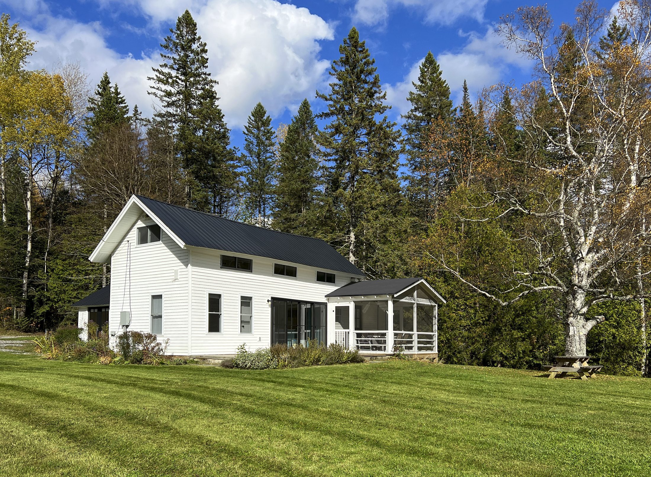 Shadow Lake Cottage — Screened porch wing from the lawn