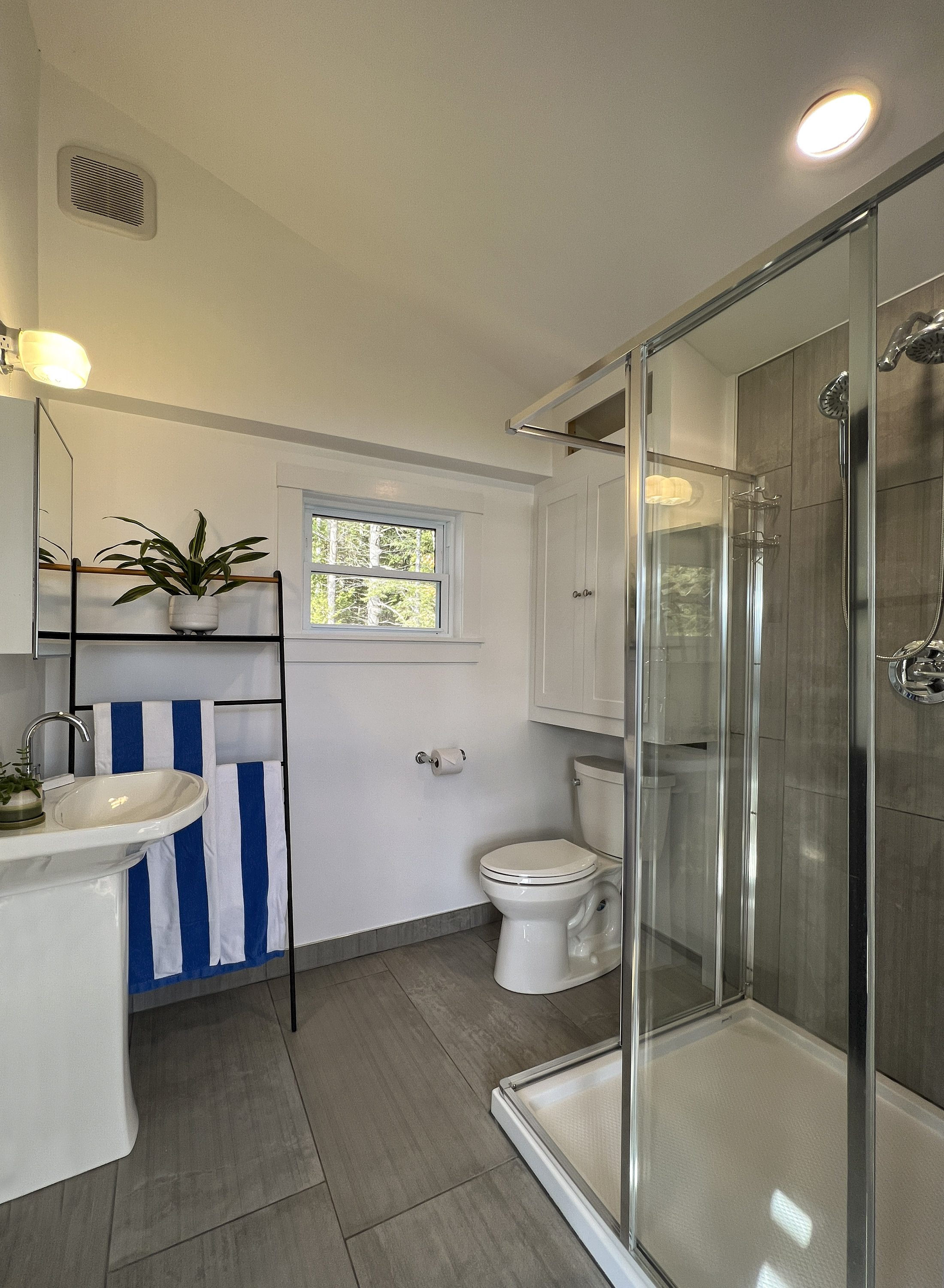Shadow Lake Cottage — New tiled bath with glass shower