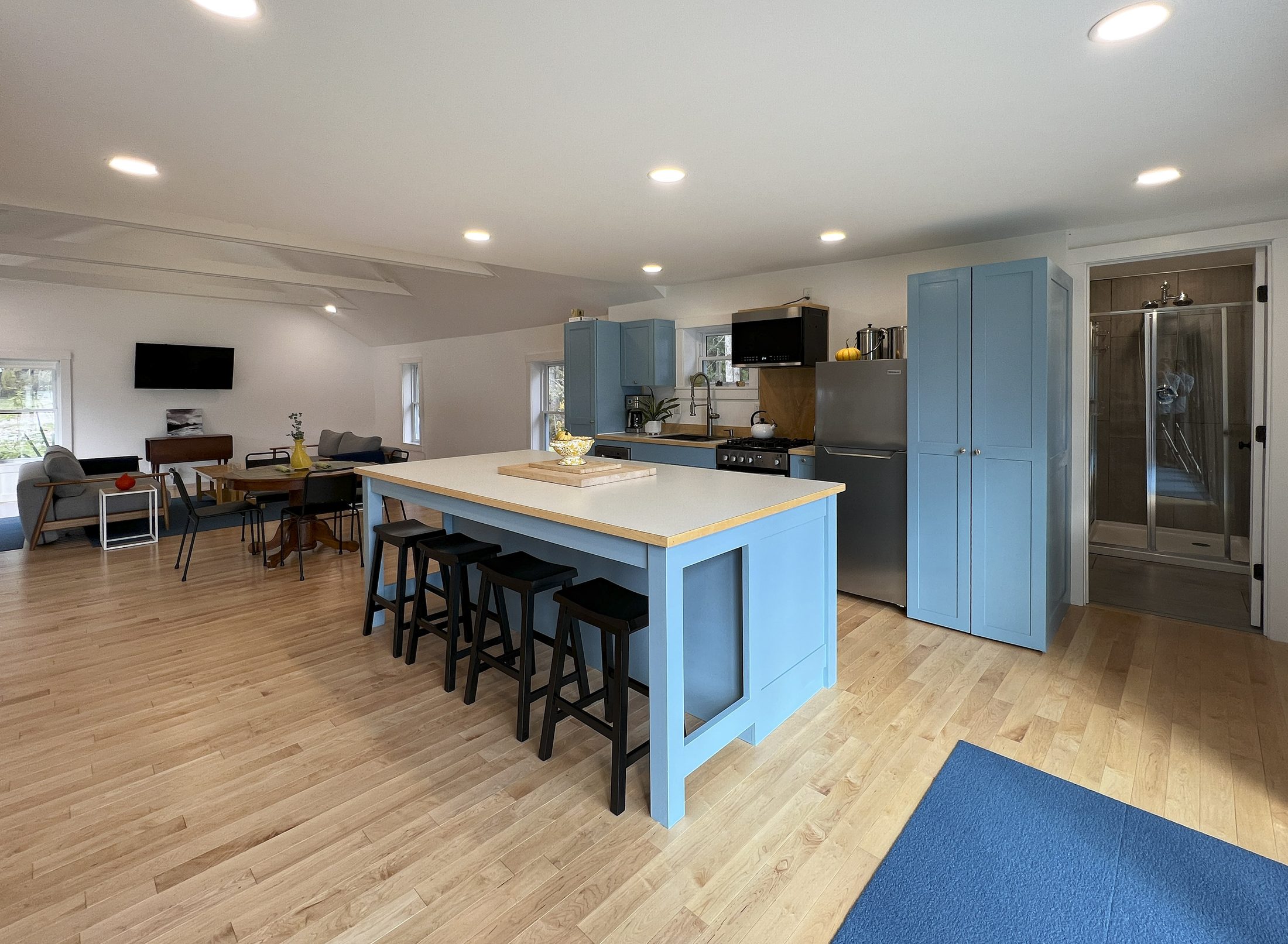 Shadow Lake Cottage — Island seating and stainless appliances